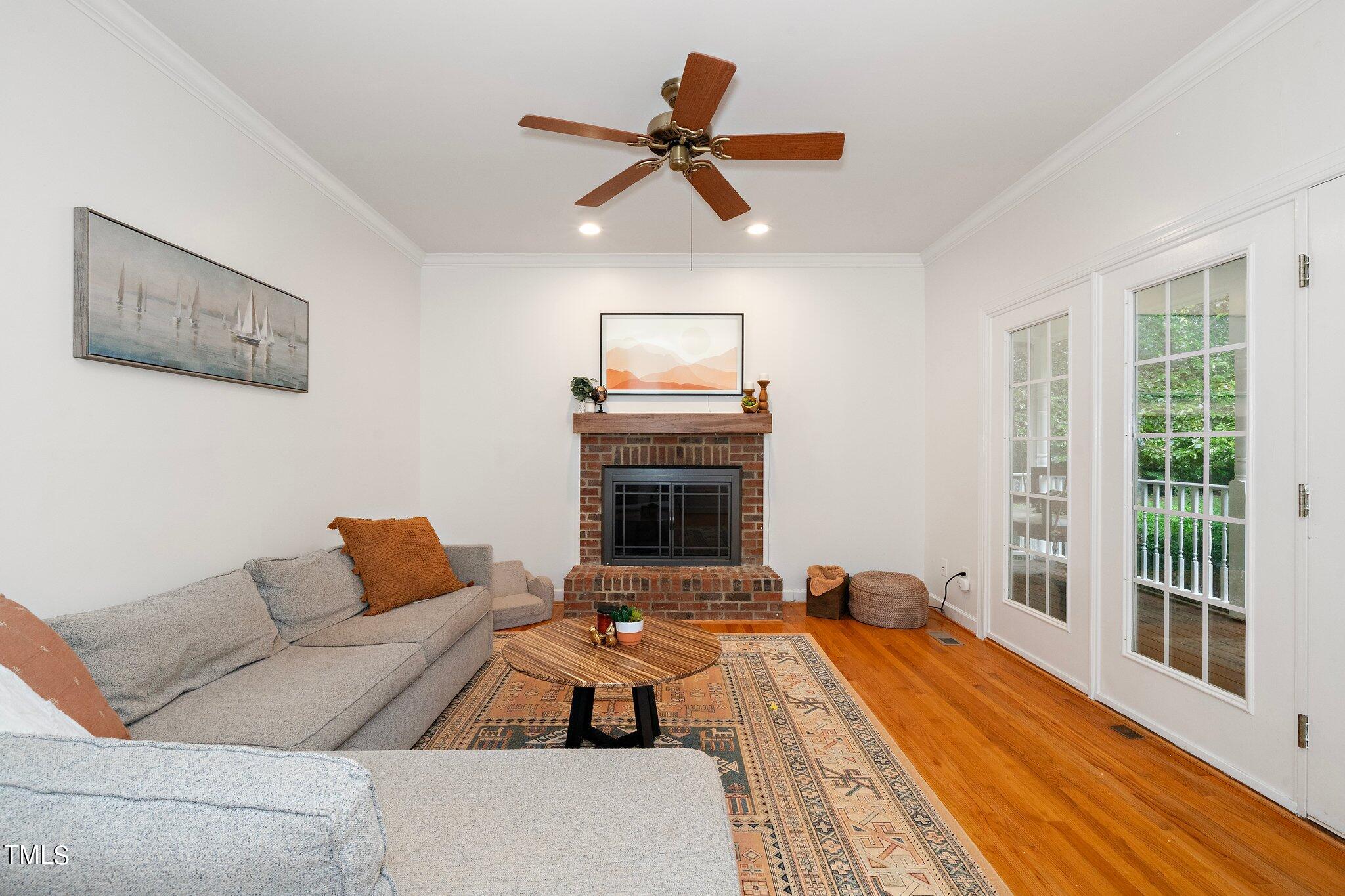 4427 Spring Meadows Road Hillsborough, NC 27278 - Photo 9 of 42 a living room with furniture and a fireplace