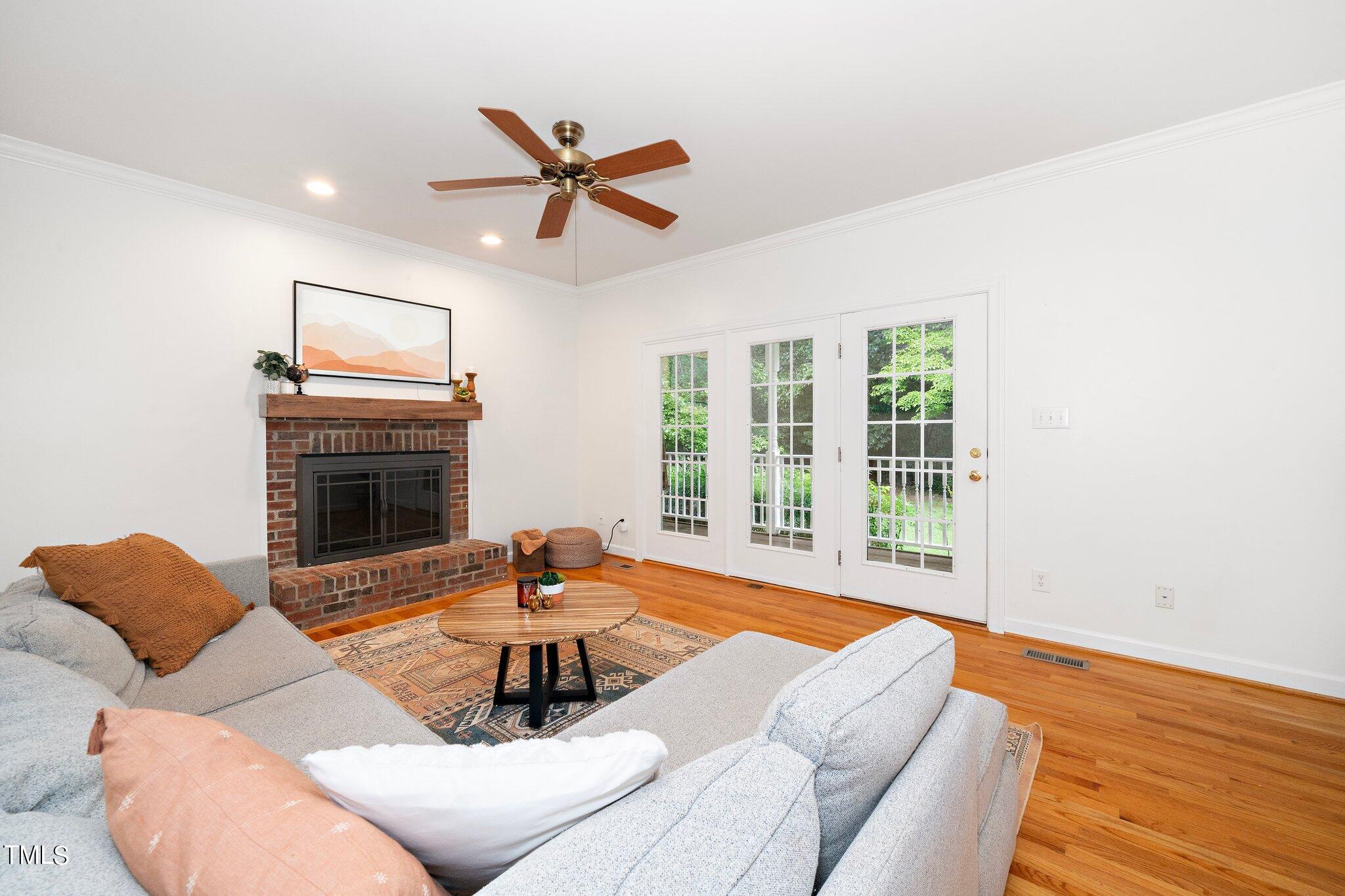 4427 Spring Meadows Road Hillsborough, NC 27278 - Photo 10 of 42 a living room with furniture and a fireplace