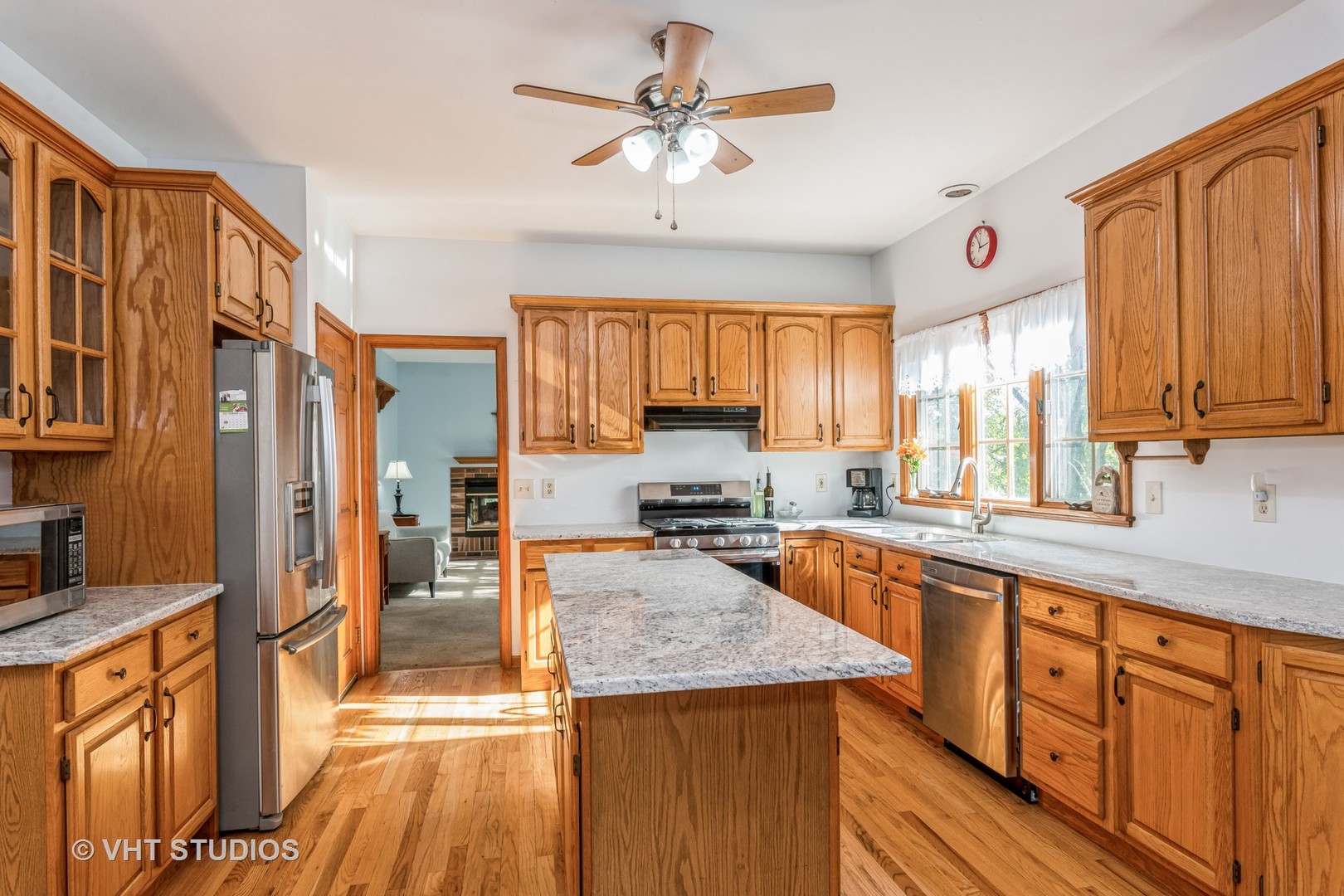 1N200 Denali Road Elburn, IL 60119 - Photo 3 of 23 a kitchen with stainless steel appliances granite countertop a stove a sink dishwasher and a refrigerator
