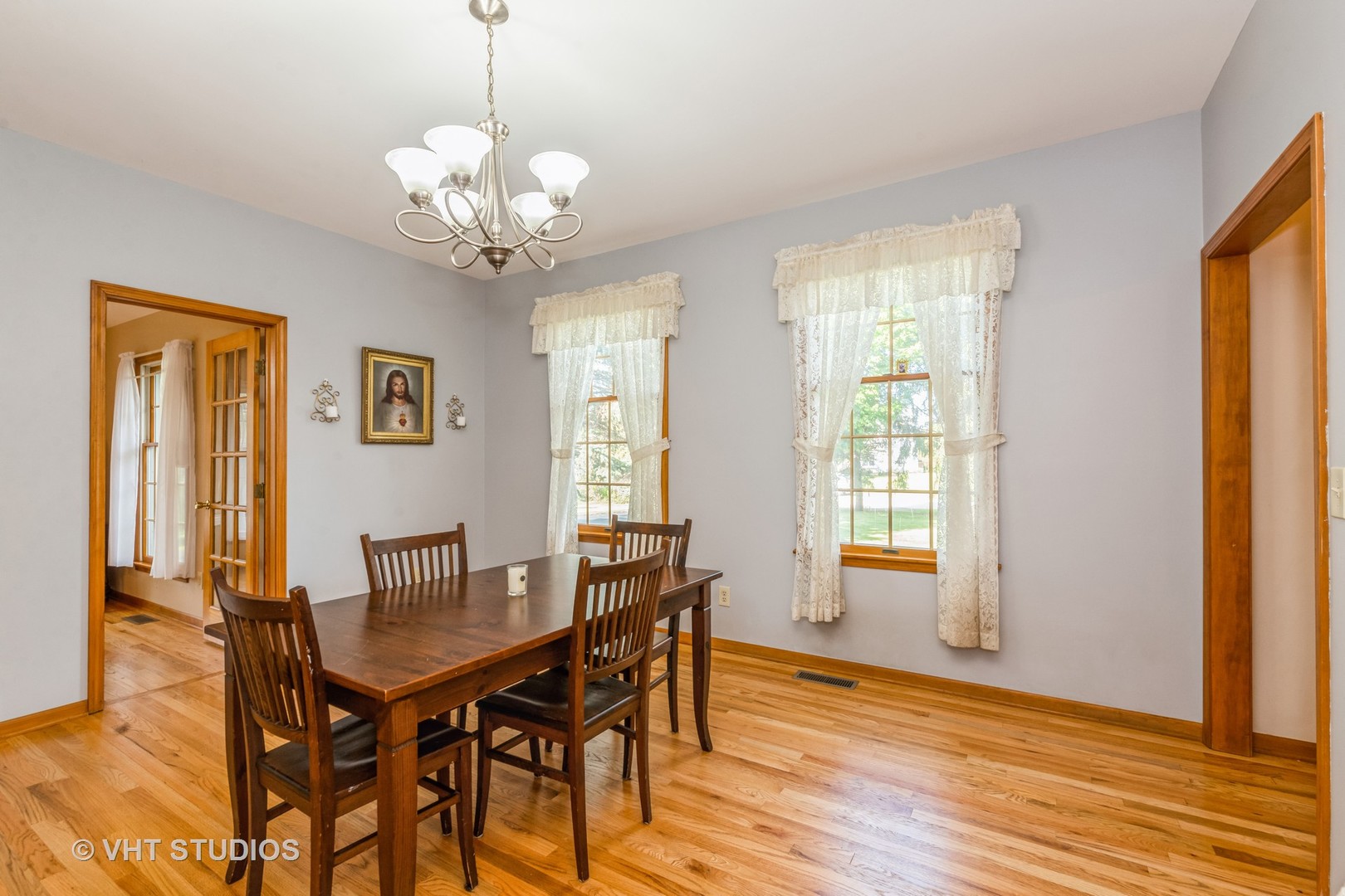 1N200 Denali Road Elburn, IL 60119 - Photo 5 of 23 a view of a dining room with furniture and wooden floor