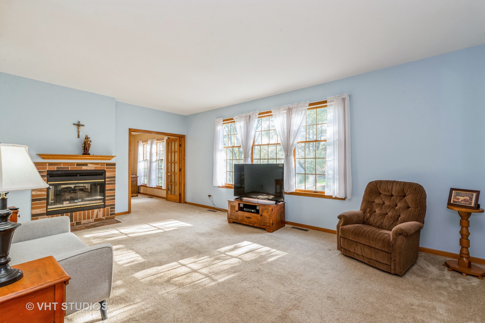1N200 Denali Road Elburn, IL 60119 - Photo 6 of 23 a living room with furniture a flat screen tv and a window