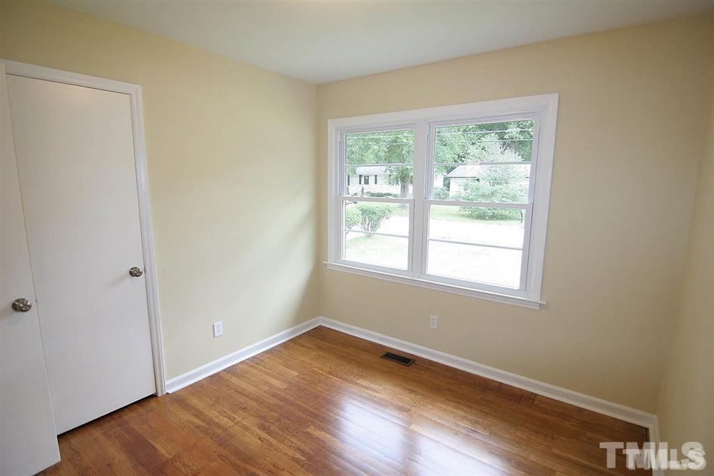 556 Dacian Road Raleigh, NC 27610 - Photo 16 of 20 a view of a room with wooden floor and window