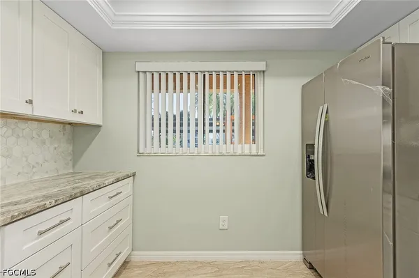a view of cabinets and window