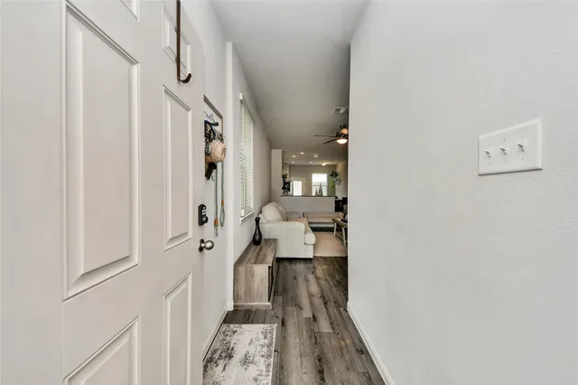 a view of a hallway with a furniture