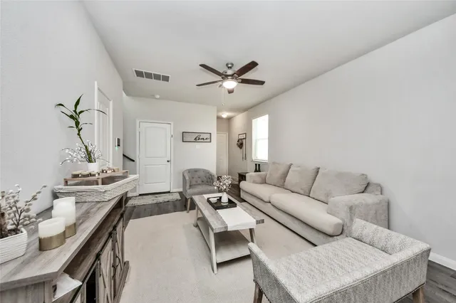 a living room with furniture and a table