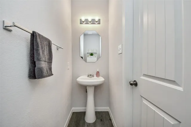 a bathroom with a sink and mirror