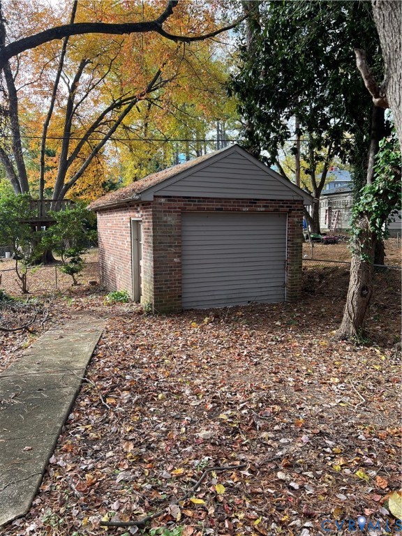 9605 Quioccasin Road Henrico, VA 23238 - Photo 6 of 10 a house with a tree in the background