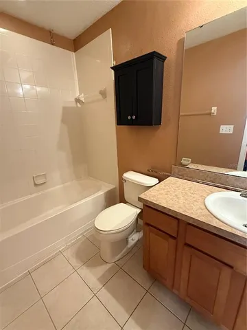 a bathroom with a sink a toilet and bathtub