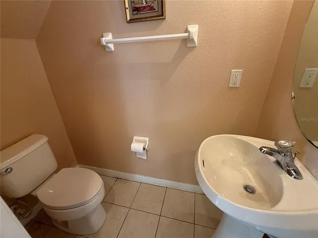 a bathroom with a sink and toilet