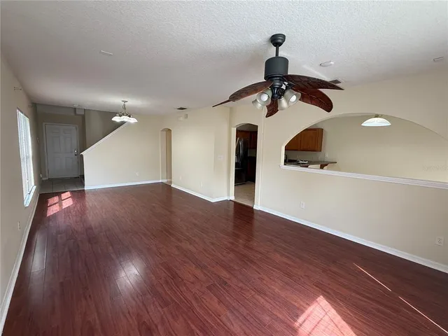 a view of a room with wooden floor