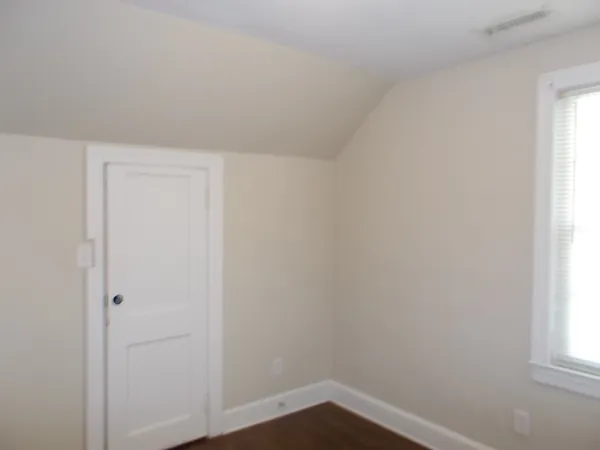 a room with a stove and a window