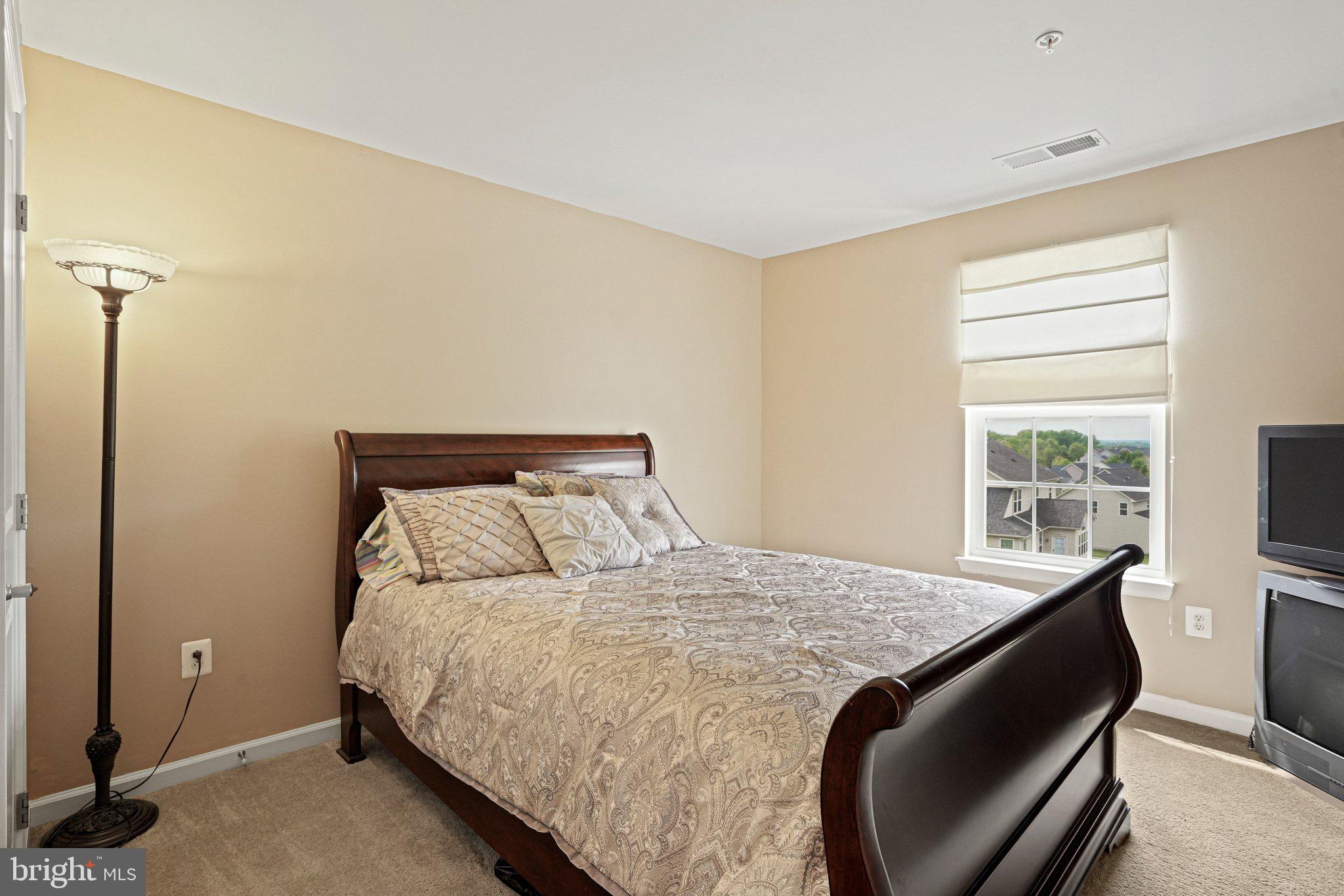 9309 Mount Vernon Way Fort Washington, MD 20744 - Photo 13 of 24 a bedroom with a bed and a window