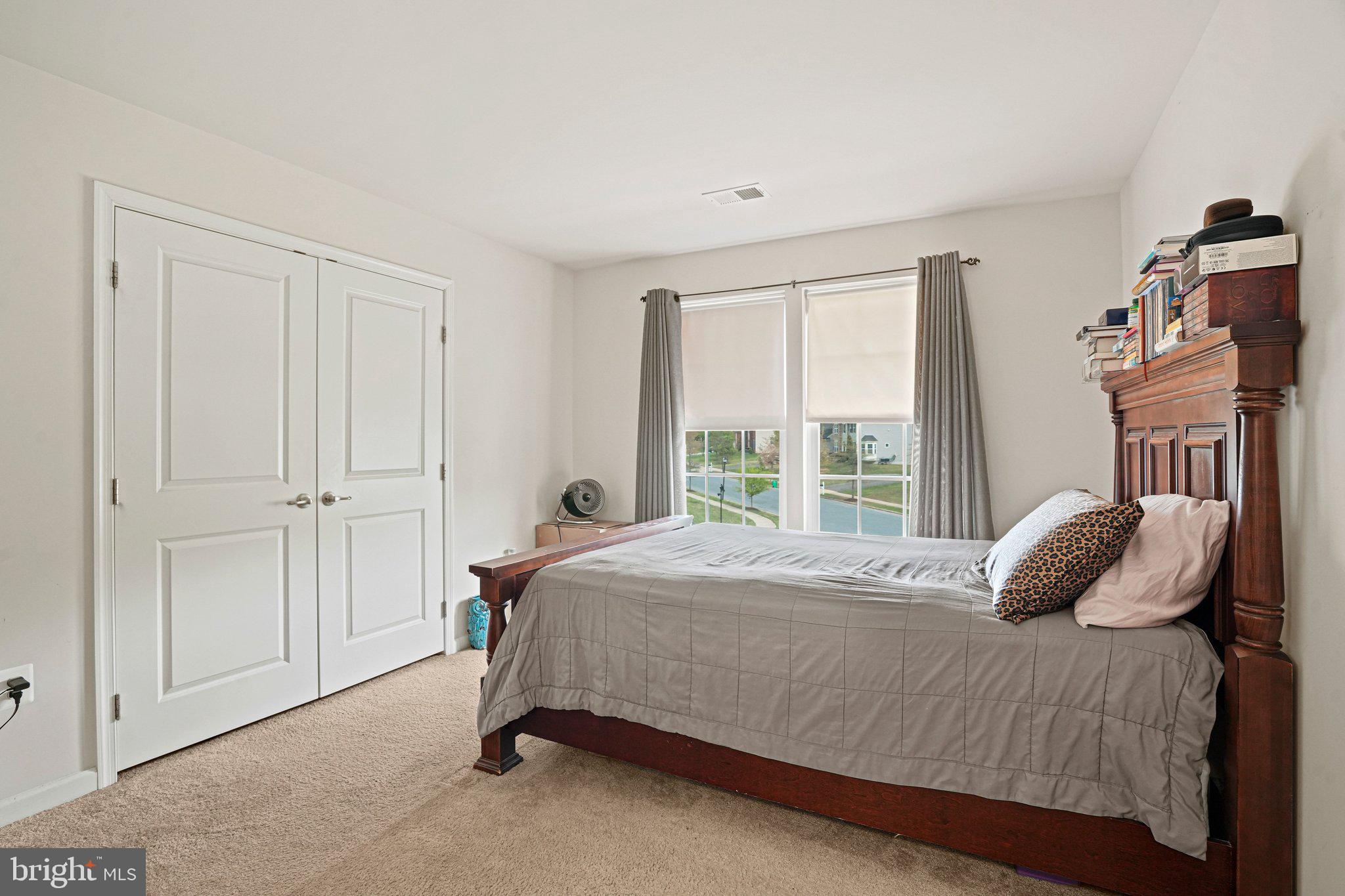 9309 Mount Vernon Way Fort Washington, MD 20744 - Photo 17 of 24 a bedroom with a bed and a window