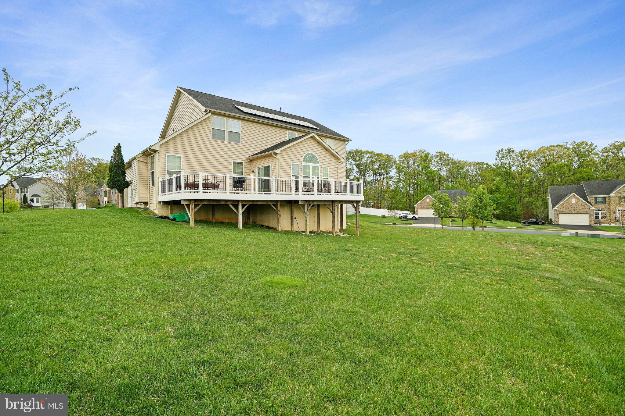9309 Mount Vernon Way Fort Washington, MD 20744 - Photo 20 of 24 a view of a house with a big yard and large trees