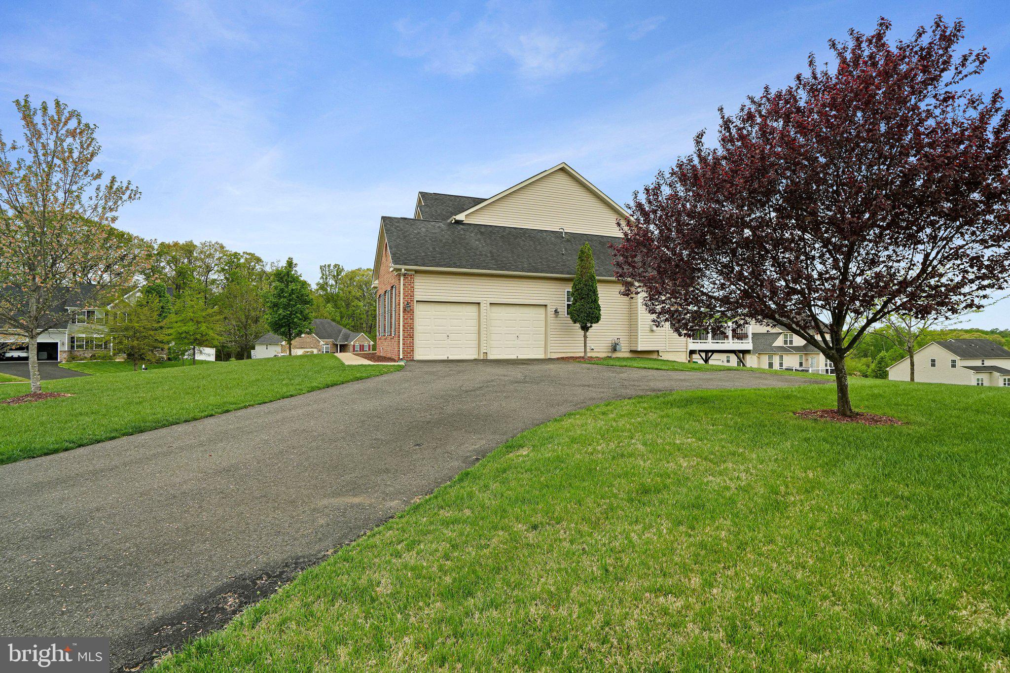 9309 Mount Vernon Way Fort Washington, MD 20744 - Photo 21 of 24 a front view of house with yard and green space