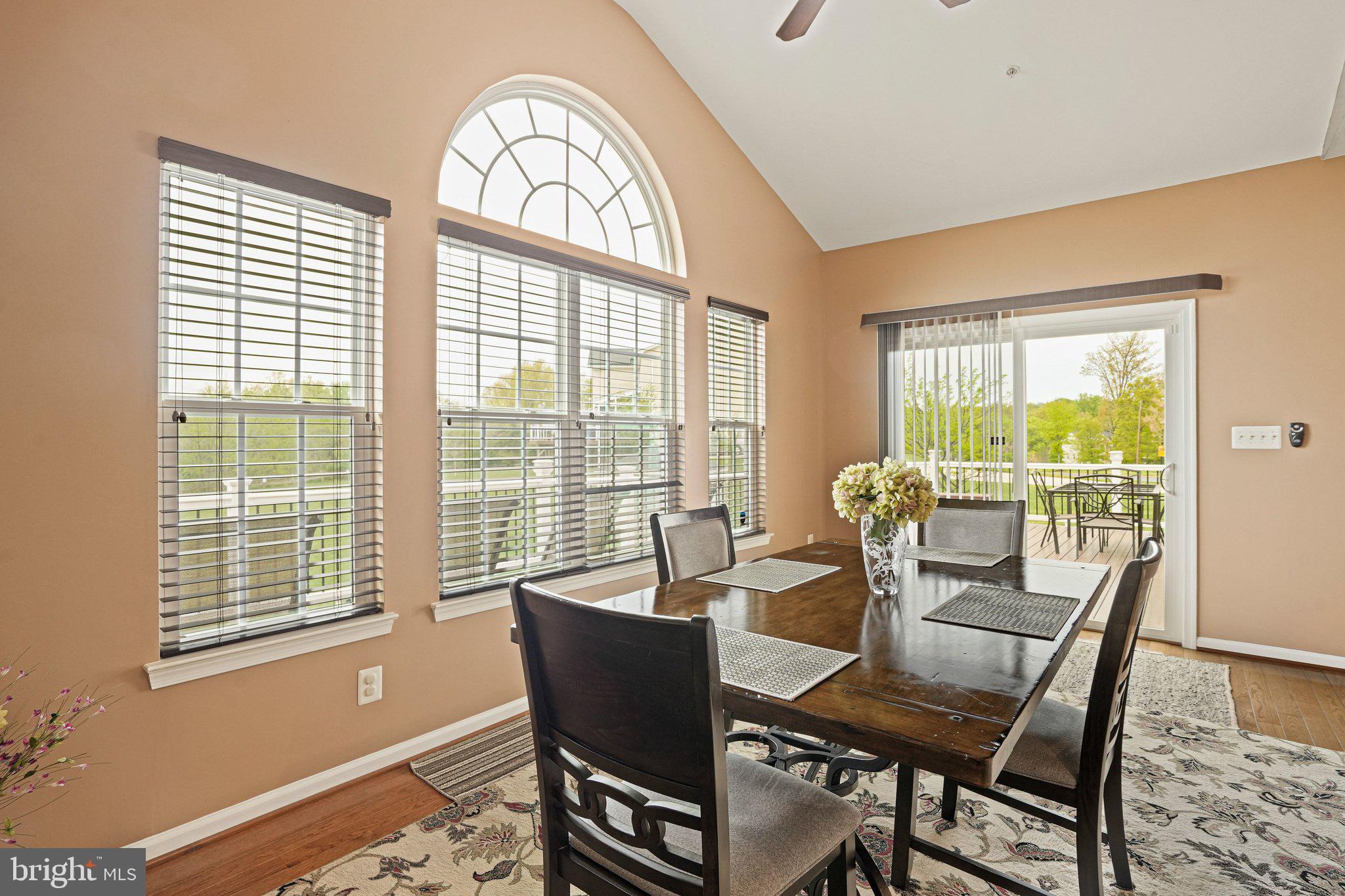 9309 Mount Vernon Way Fort Washington, MD 20744 - Photo 6 of 24 a dining room with furniture large windows and wooden floor