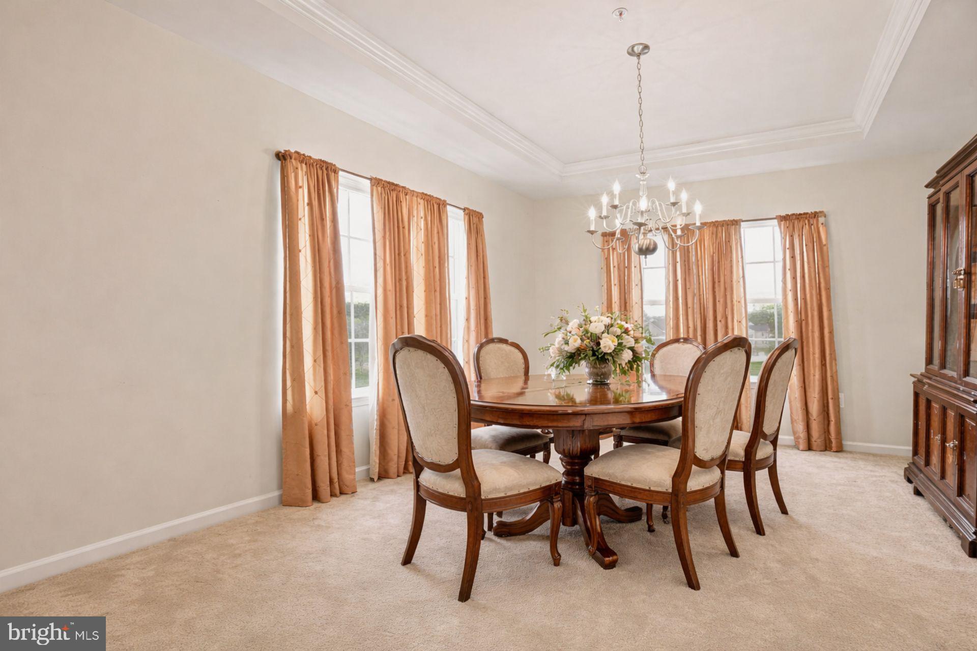 9309 Mount Vernon Way Fort Washington, MD 20744 - Photo 9 of 24 a dining room with furniture a chandelier and window