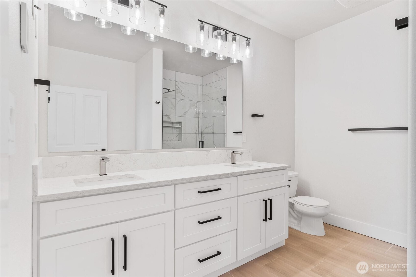 14915 38th Drive Southeast, Unit F3011 Bothell, WA 98012 - Photo 17 of 40 a spacious bathroom with a double vanity sink mirror and toilet