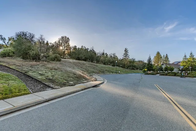 a view of a road with a building in the background