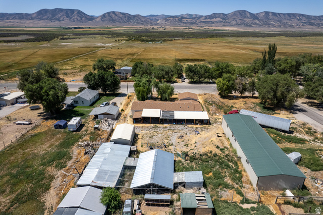 445 South Main Street Fayette, UT 84630 - Photo 9 of 45 Aerial view of sparsely populated area with a mountain backdrop and nearby suburban area