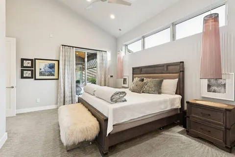 a bedroom with bed and window