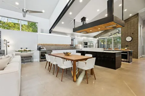 a kitchen with a table and chairs in it