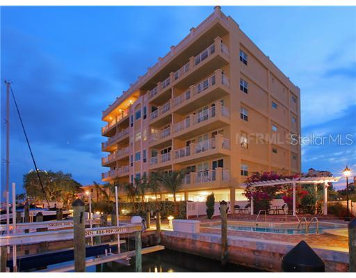 650 Golden Gate Point, Unit 303 Sarasota, FL 34236 - Photo 1 of 1 a front view of a building with glass windows