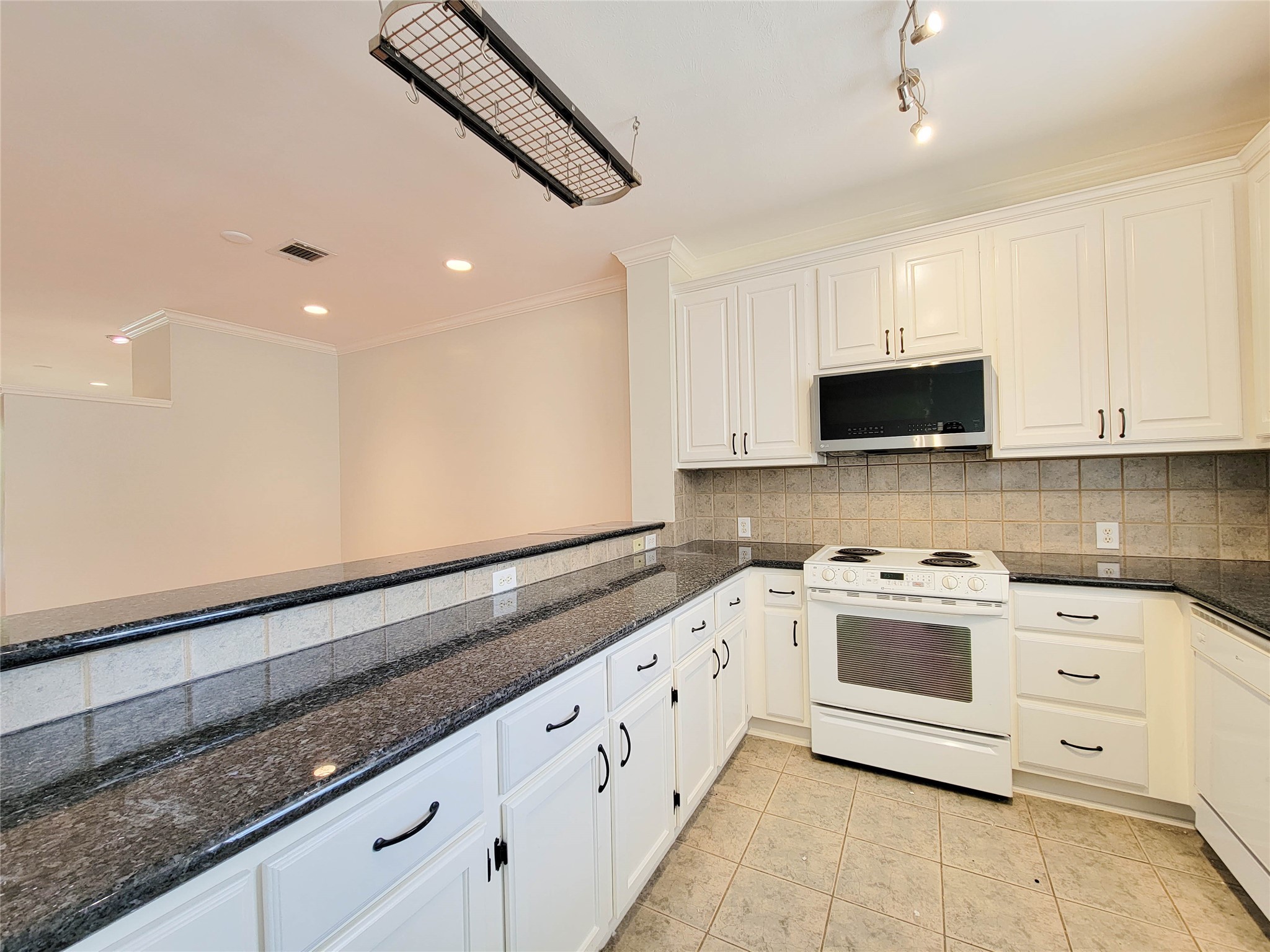 3010 La Branch Street Houston, TX 77004 - Photo 20 of 43 a kitchen with granite countertop white cabinets white stainless steel appliances with a sink and dishwasher