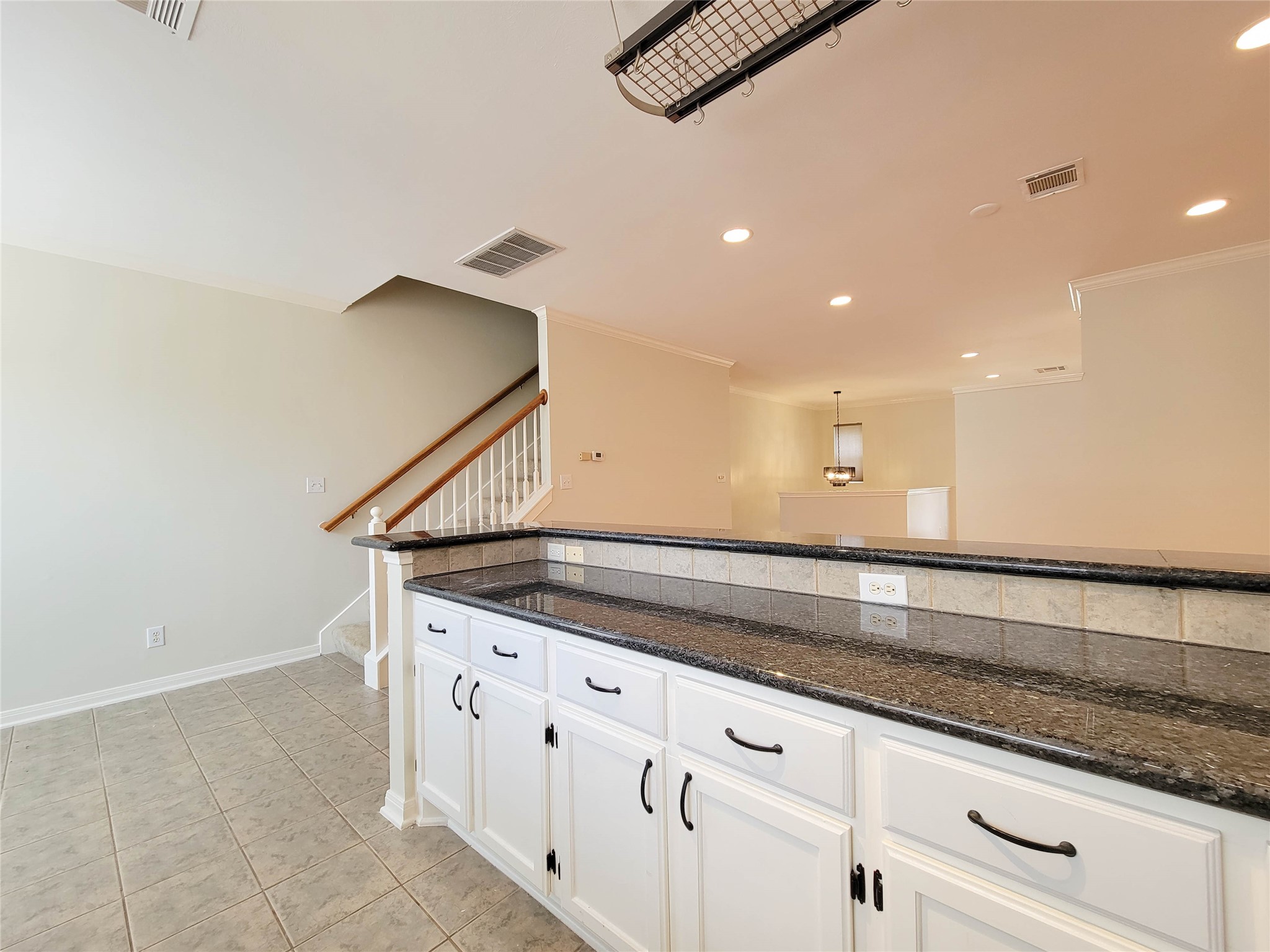 3010 La Branch Street Houston, TX 77004 - Photo 22 of 43 a kitchen with granite countertop a sink and white cabinets