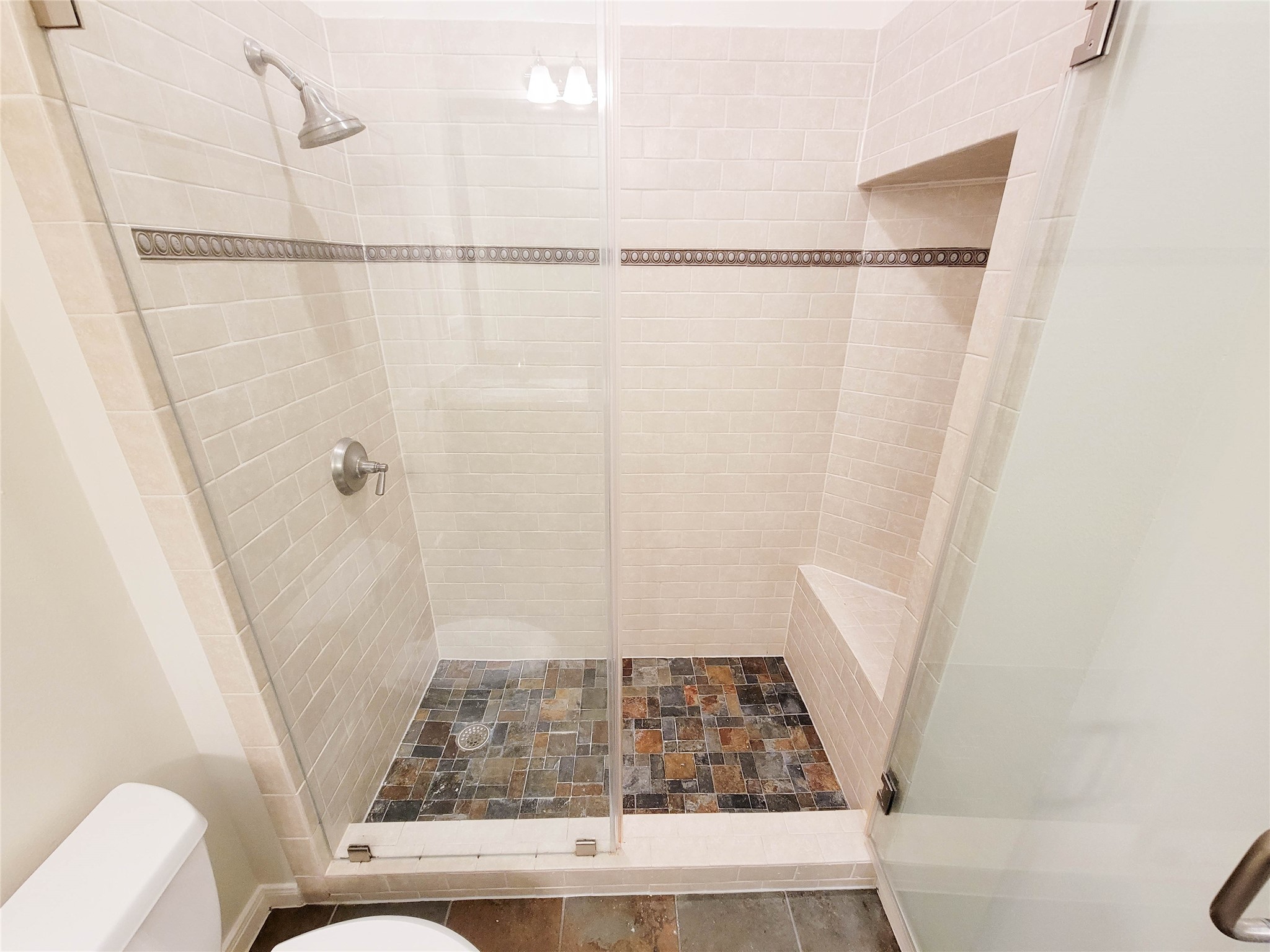 3010 La Branch Street Houston, TX 77004 - Photo 27 of 43 a bathroom with a shower and toilet