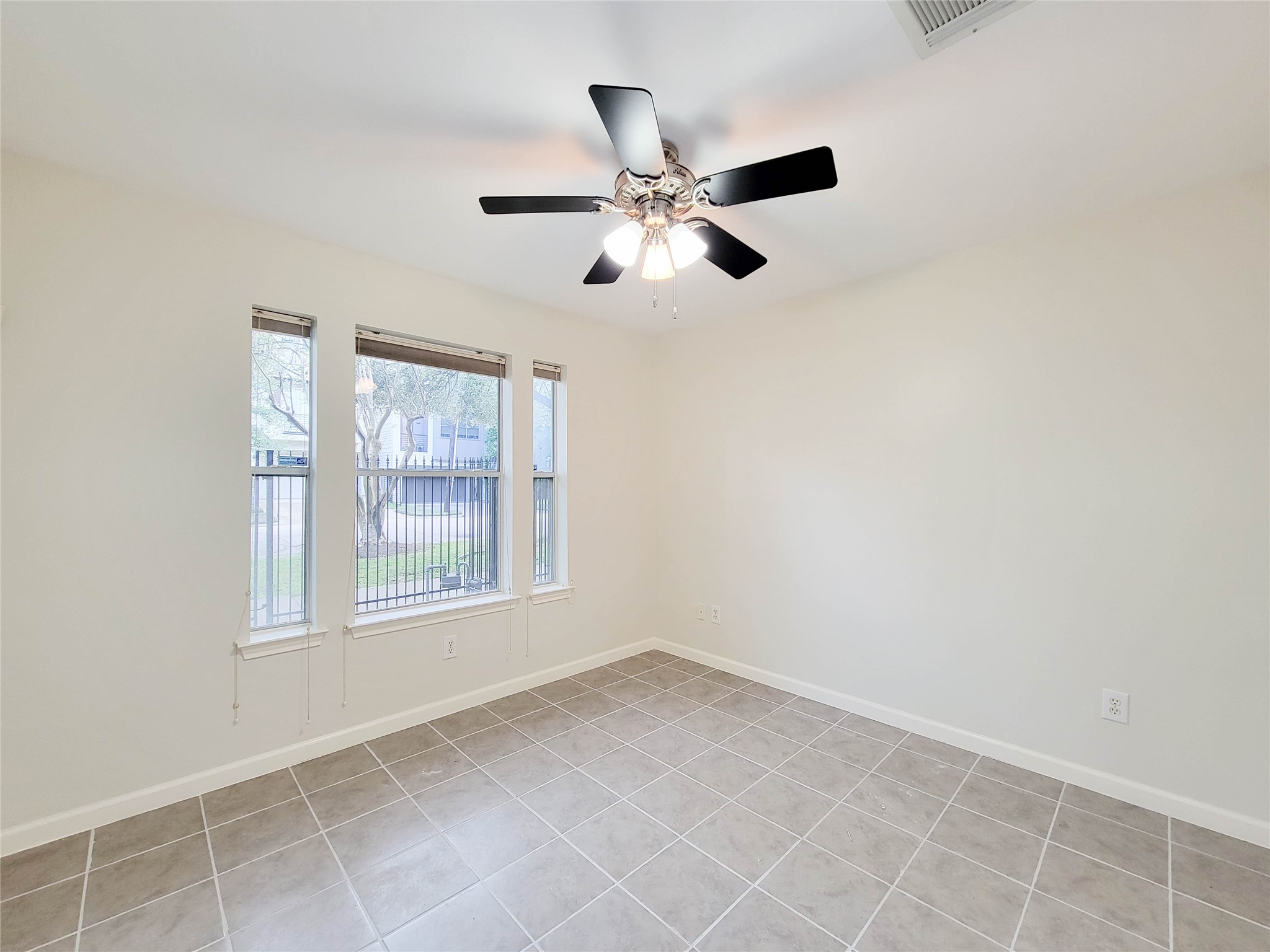 3010 La Branch Street Houston, TX 77004 - Photo 3 of 43 an empty room with windows and fan