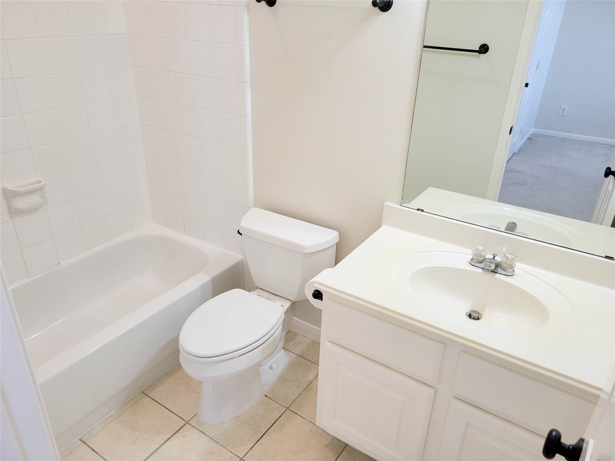 3010 La Branch Street Houston, TX 77004 - Photo 32 of 43 a white toilet sitting next to a bathroom sink