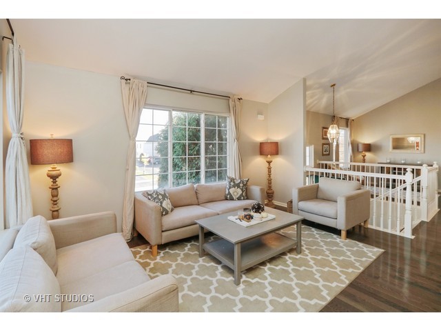 600 South Rosehall Lane Round Lake, IL 60073 - Photo 6 of 16 a living room with furniture and a table