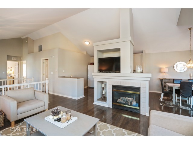 600 South Rosehall Lane Round Lake, IL 60073 - Photo 7 of 16 a living room with furniture a fireplace and a fireplace