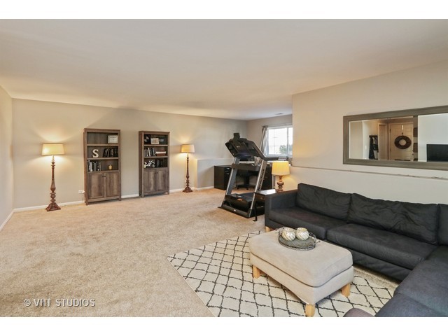 600 South Rosehall Lane Round Lake, IL 60073 - Photo 9 of 16 a living room with furniture and a dining table