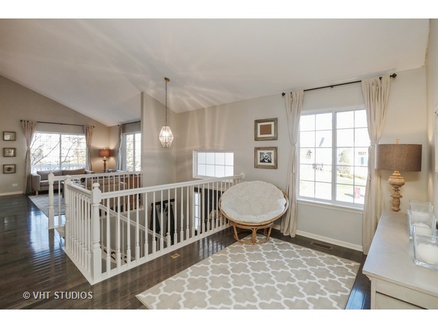 600 South Rosehall Lane Round Lake, IL 60073 - Photo 10 of 16 a living room with furniture a window and a dining table