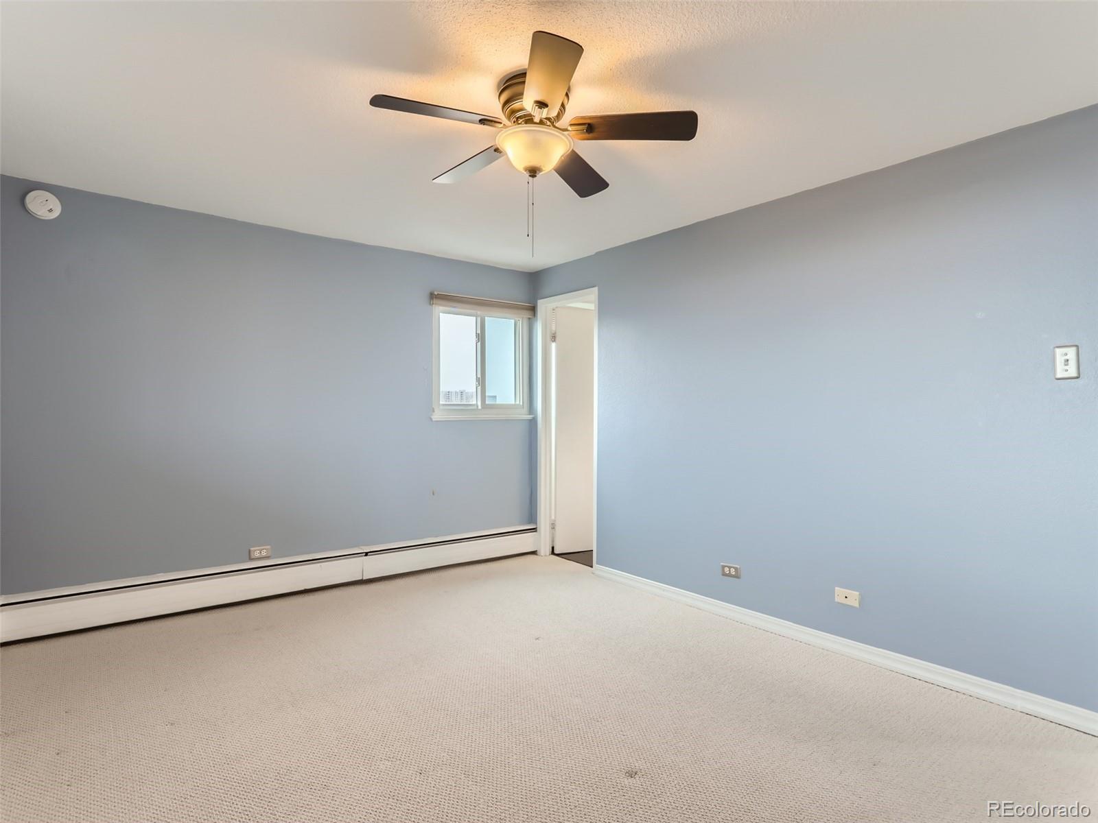 1029 East 8th Avenue, Unit 502 Denver, CO 80218 - Photo 13 of 26 a view of an empty room with a window
