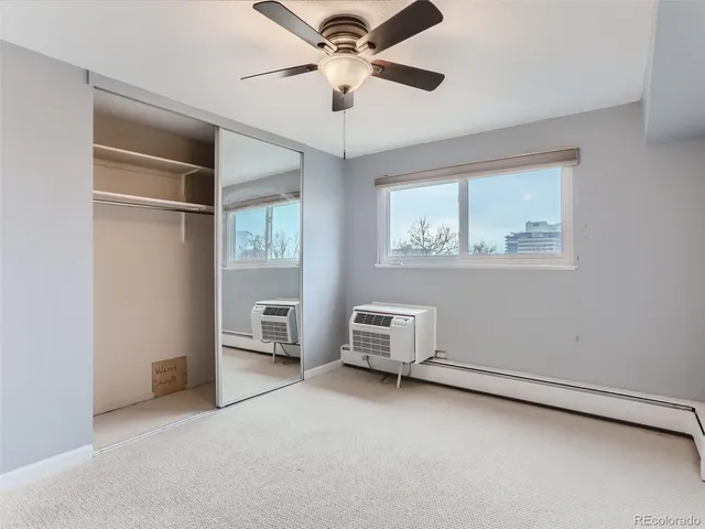 a view of room with cabinet and ceiling fan