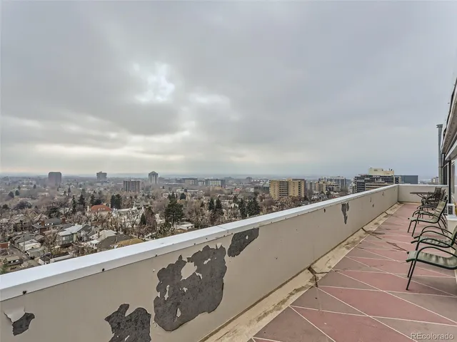 a view of balcony with furniture