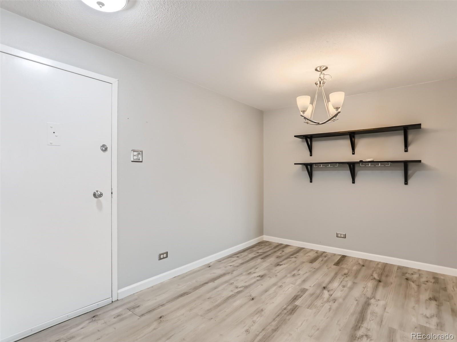 1029 East 8th Avenue, Unit 502 Denver, CO 80218 - Photo 8 of 26 a view of a room with wooden floor and sink