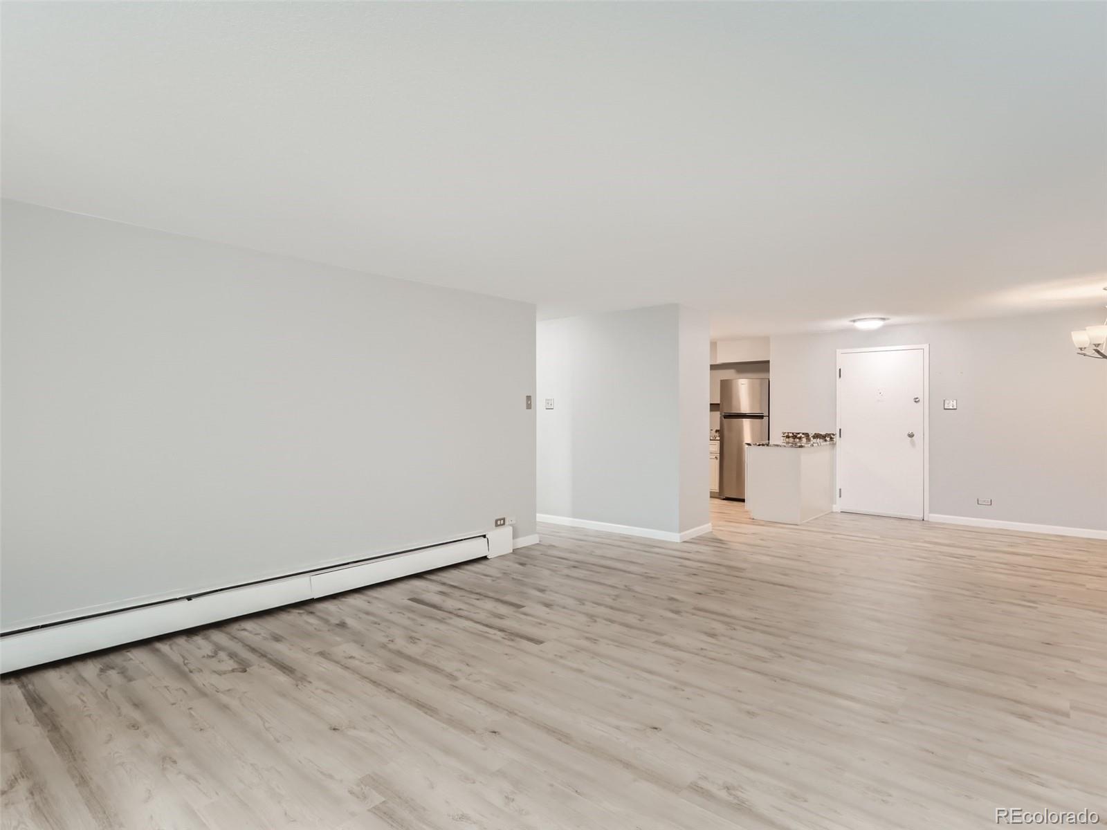1029 East 8th Avenue, Unit 502 Denver, CO 80218 - Photo 9 of 26 a view of empty room with wooden floor