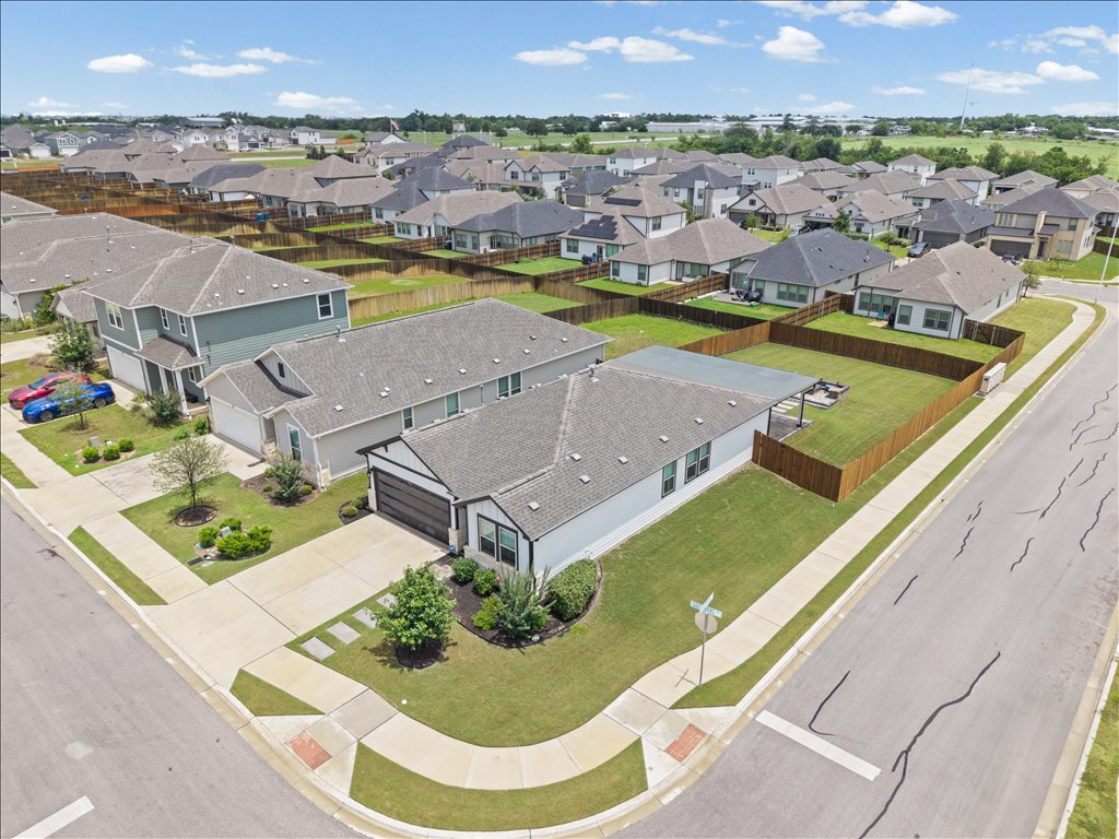 158 Gullivers Drive Elgin, TX 78621 - Photo 28 of 36 If you look at this aerial view, you can see how perfectly positioned the home is on the corner lot.