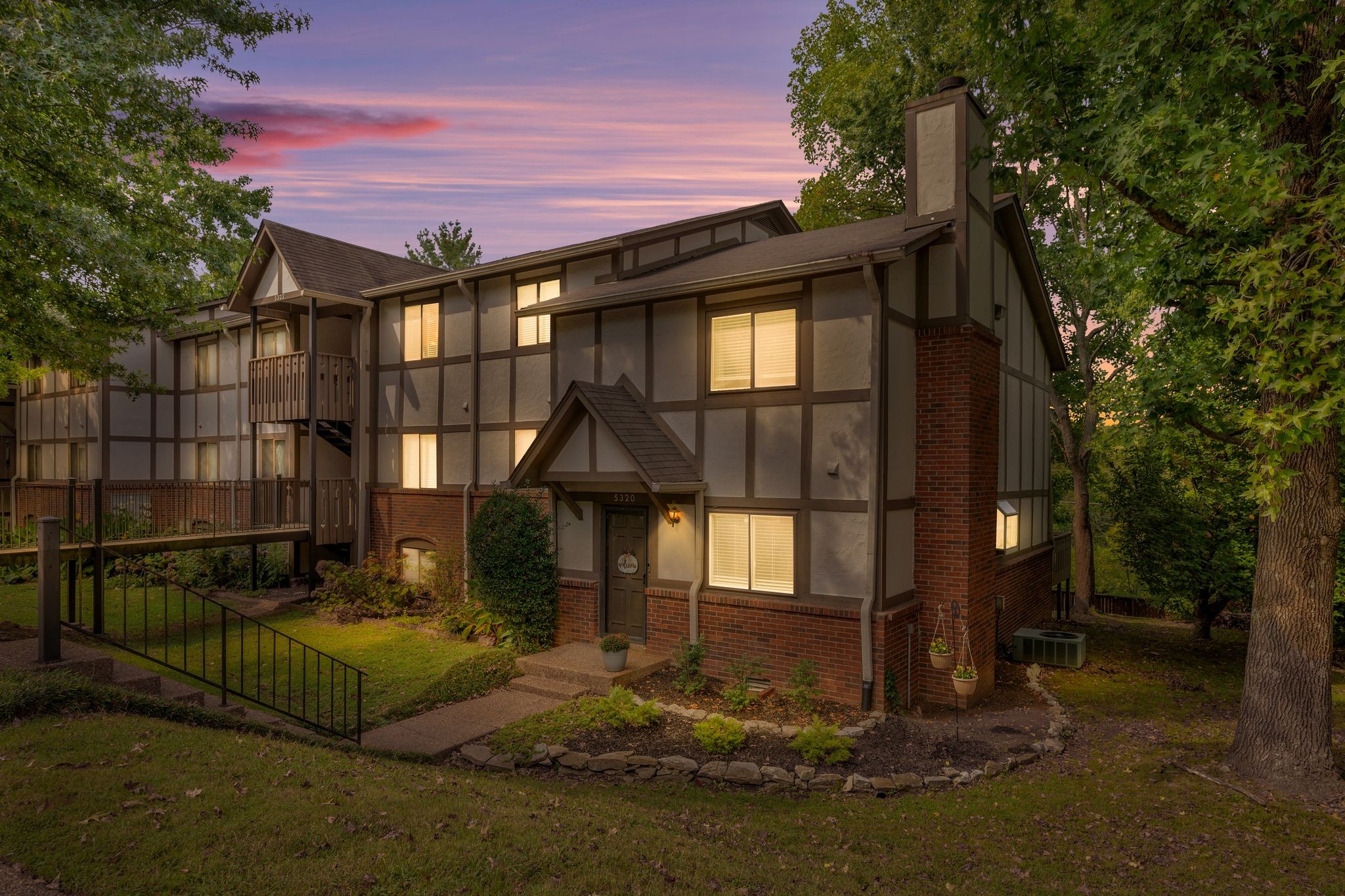 a front view of a house with garden