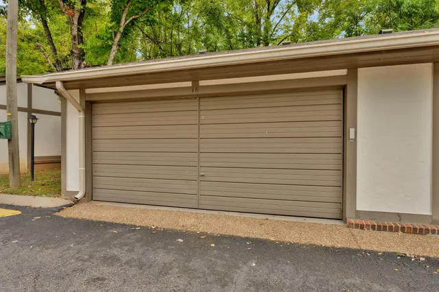 a side view of a house with a garage