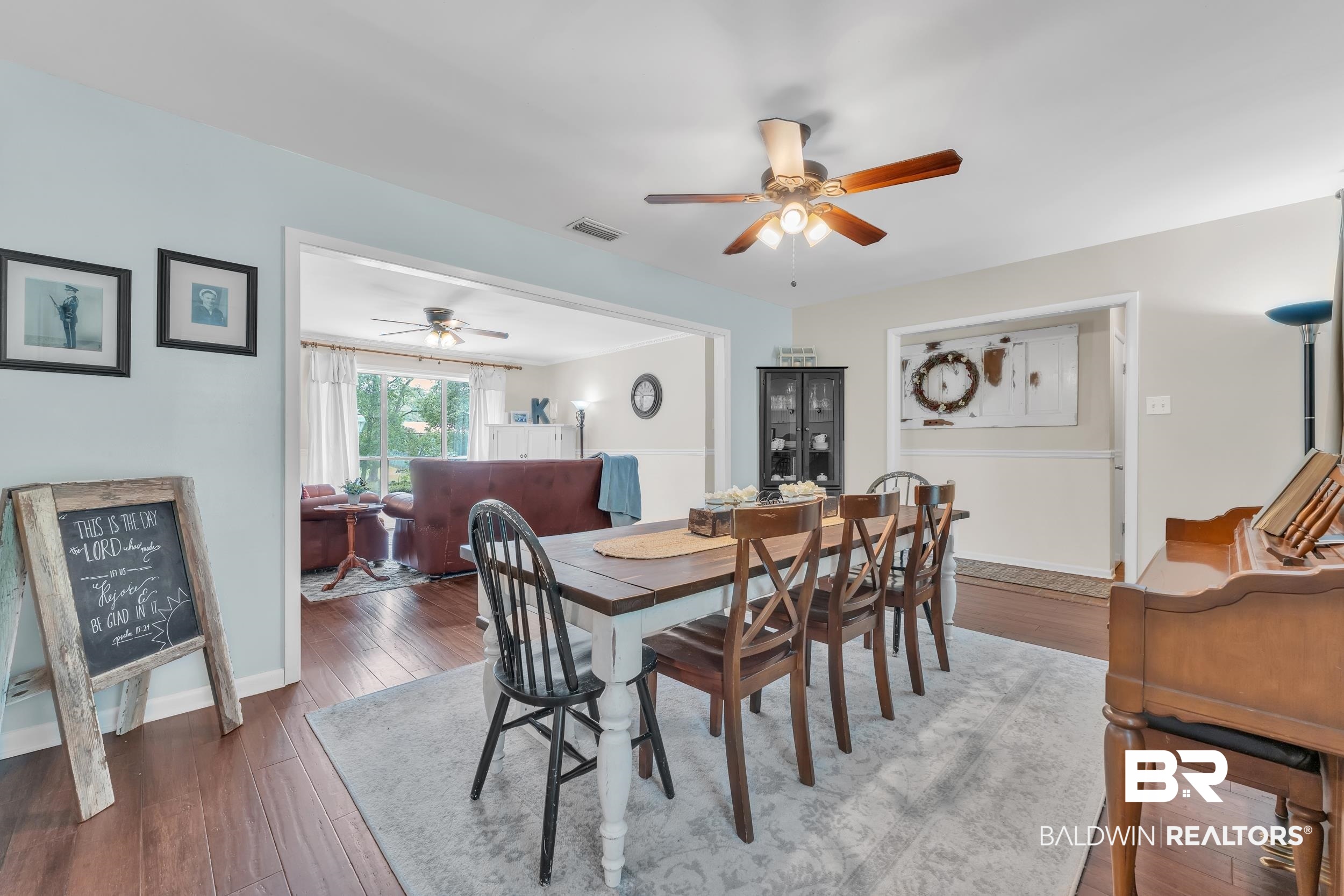 224 Cache Circle Mobile, AL 36611 - Photo 5 of 42 Dining room with ceiling fan, wood-type flooring, and baseboards