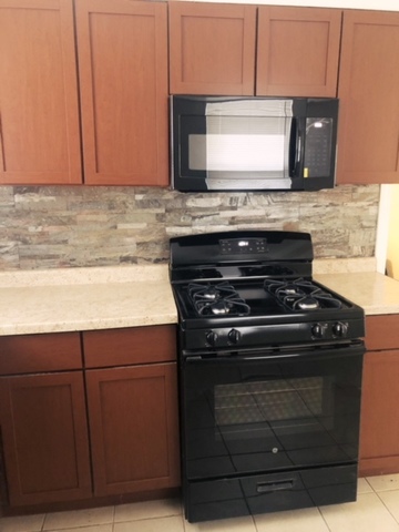 2144 Spruce Road Homewood, IL 60430 - Photo 12 of 13 a stove top oven sitting inside of a kitchen