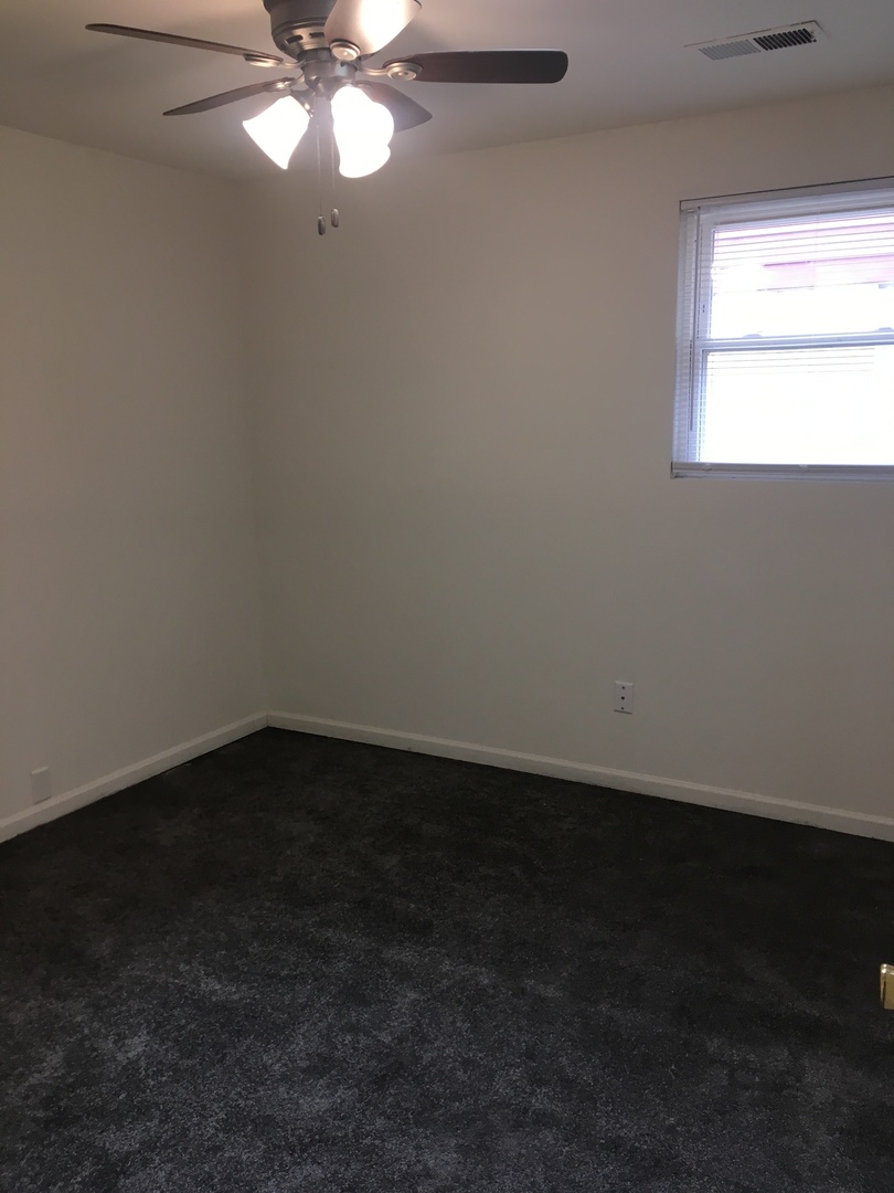 2144 Spruce Road Homewood, IL 60430 - Photo 7 of 13 a view of an empty room and window