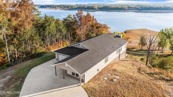 a view of a lake with houses in the back