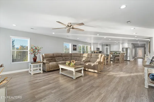a living room with lots of furniture and white walls