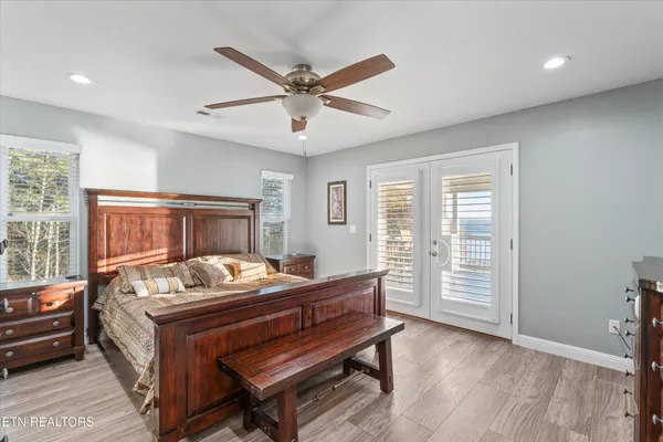 a room with furniture pool table and windows